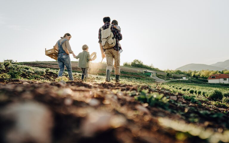 Photo of a happy family touring their plantation